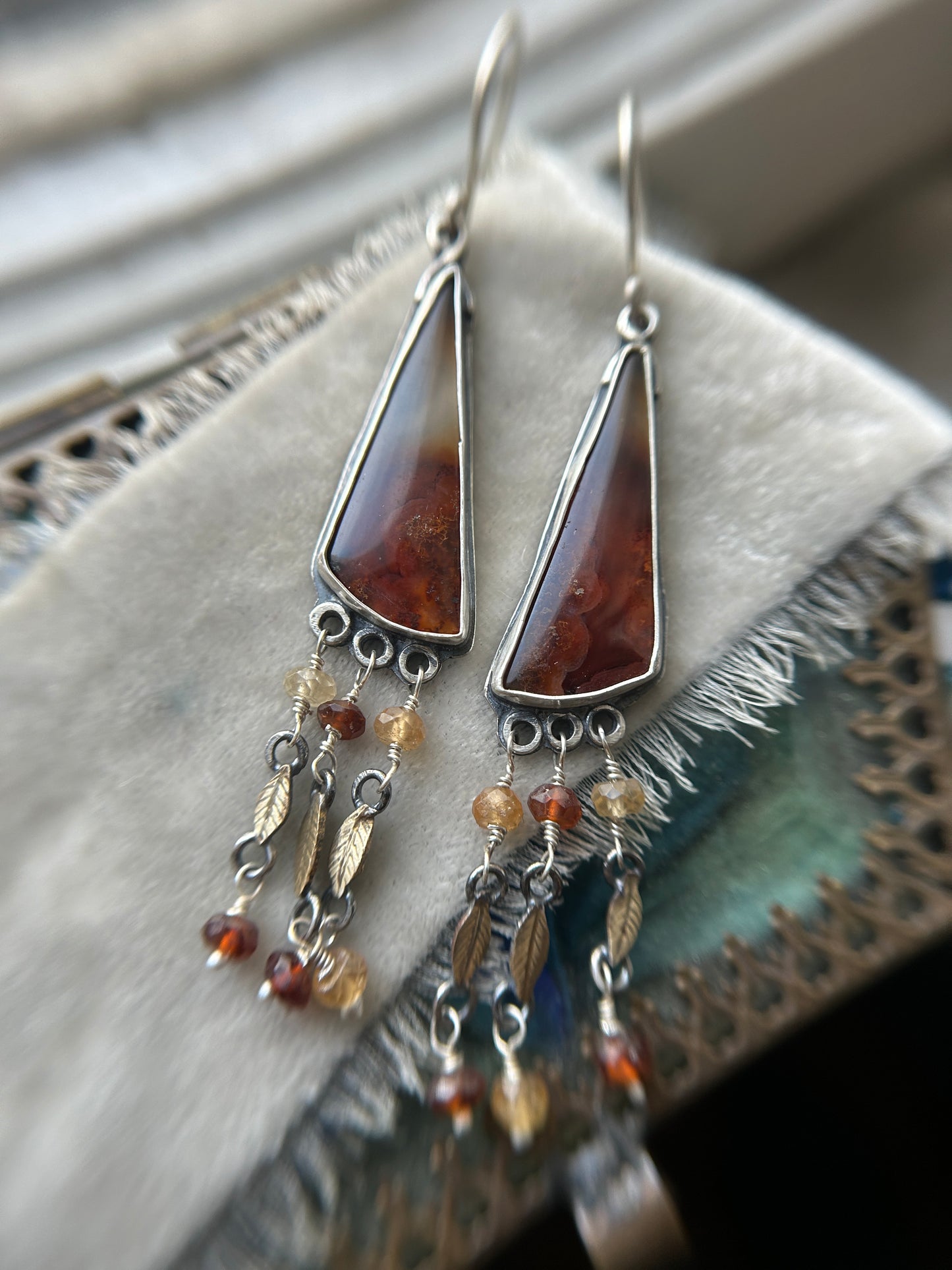 Carnelian Crow Earrings- sterling silver earrings with brass leaves and hessonite garnet details