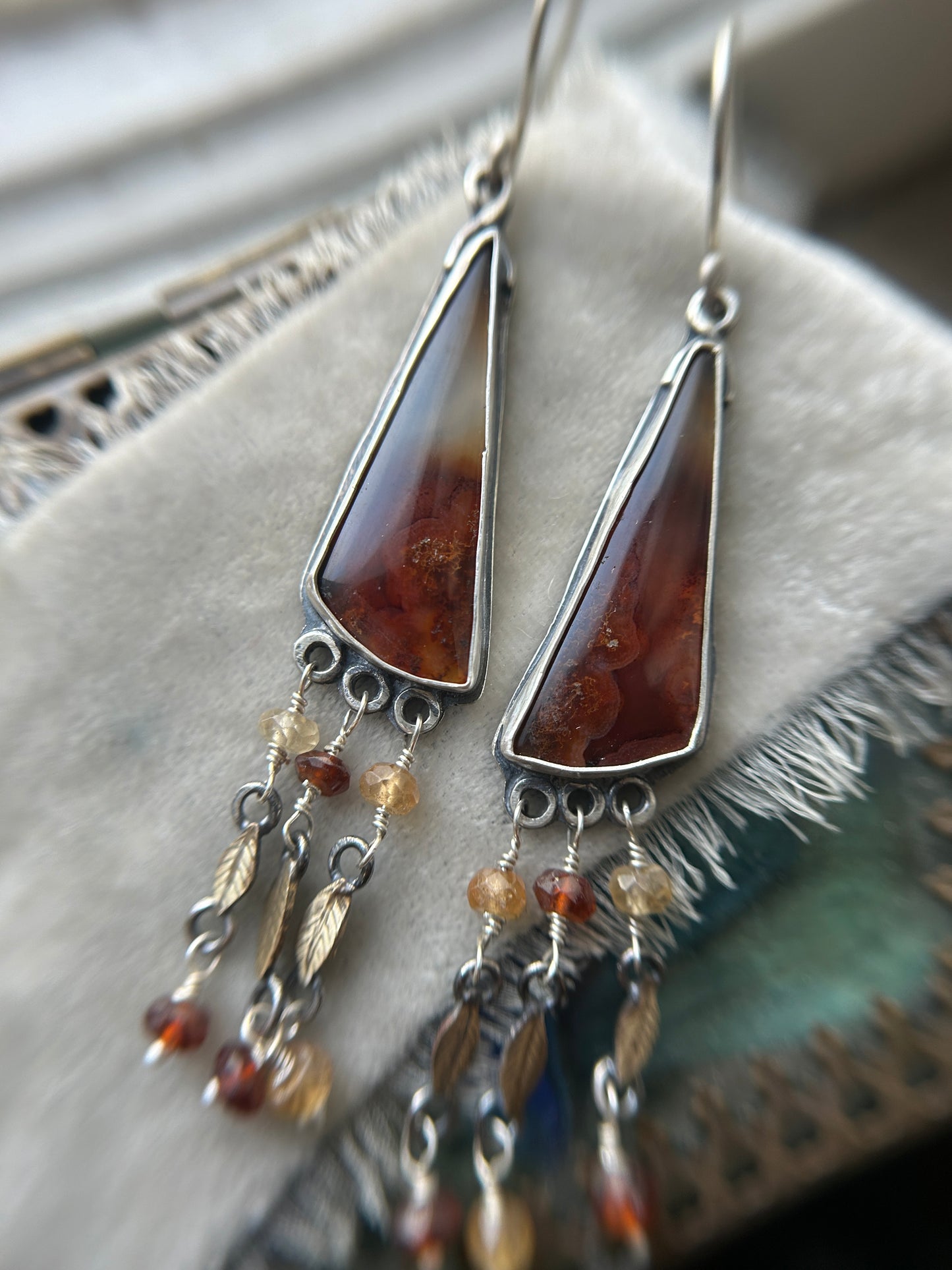 Carnelian Crow Earrings- sterling silver earrings with brass leaves and hessonite garnet details