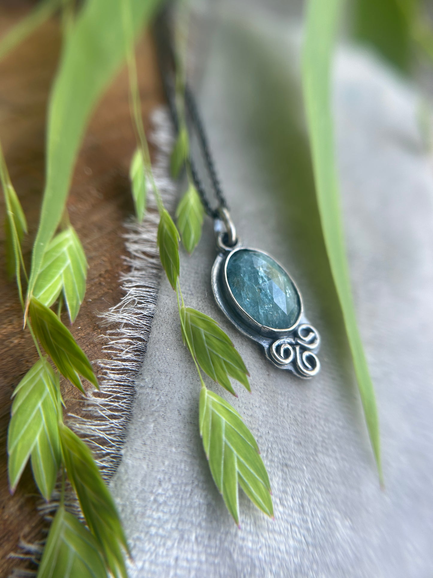 Aqua Kyanite with triskelle spirals and albatross- sterling silver necklace metalsmith made