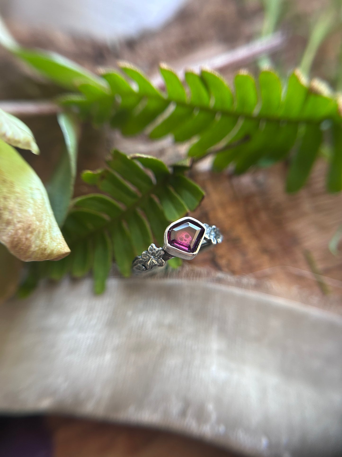 Azalea flowers and skull ring with portrait cut shield shaped rhodolite garnet- Sterling silver jewelry