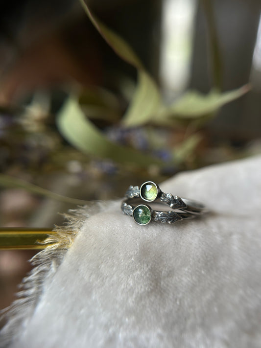 Top ring shows the v shape peridot oak leaf ring. Bottom ring shows classic shape moss agate oak leaf ring